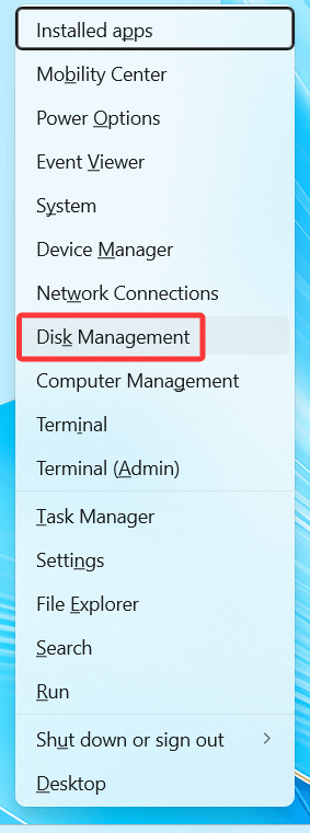 Press Windows + X and select Disk Management