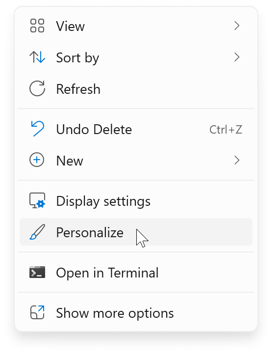Right-click on the desktop and select Personalize
